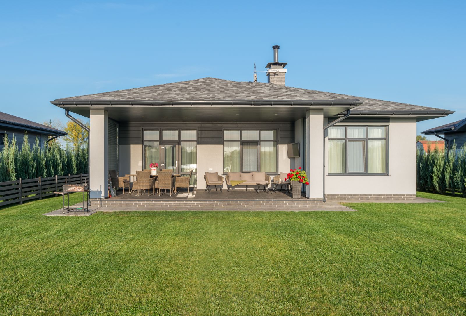A finished backyard with a fresh lawn and beds