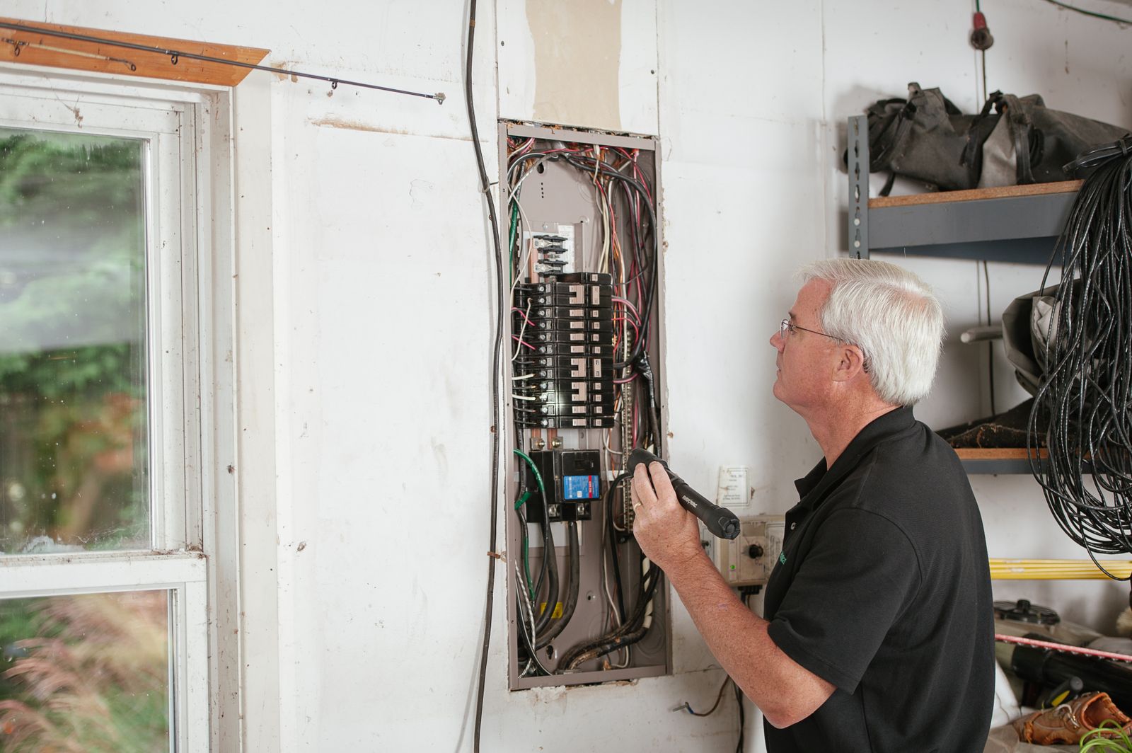 A technician checking a panel